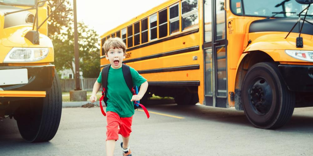 School bus and kid