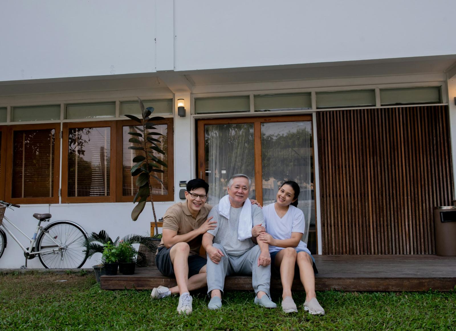 family in front of house